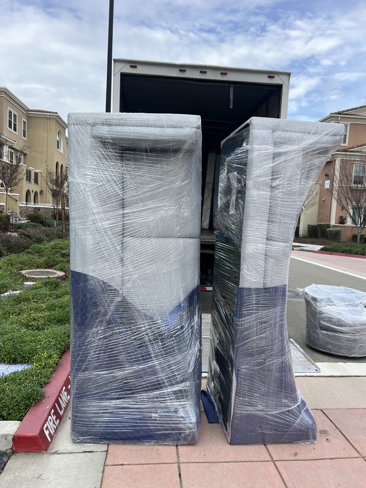 Large furniture items wrapped and ready for transport